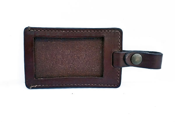 Luggage tag in thick brown cowhide